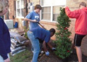Boy Scouts from Troop 1865 help with landscaping