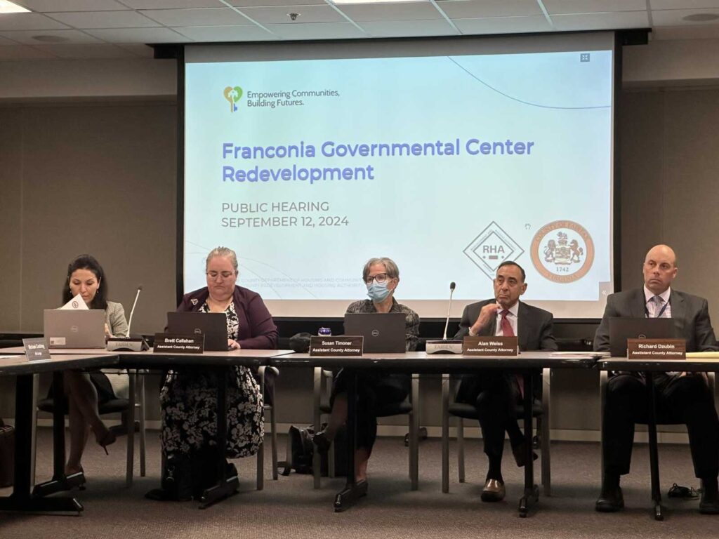 County staff await a presentation at the Fairfax County Redevelopment and Housing Authority’s public hearing on an interim agreement to redevelop the Franconia Governmental Center site (staff photo by Angela Woolsey) 